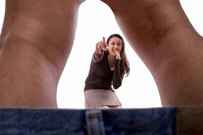 Girl laughing at man